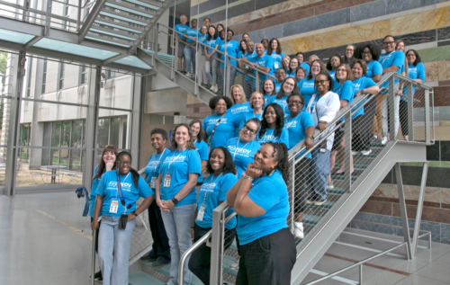 Hearing Each Other's Voices (HEOV) project participants pose for a group photo.