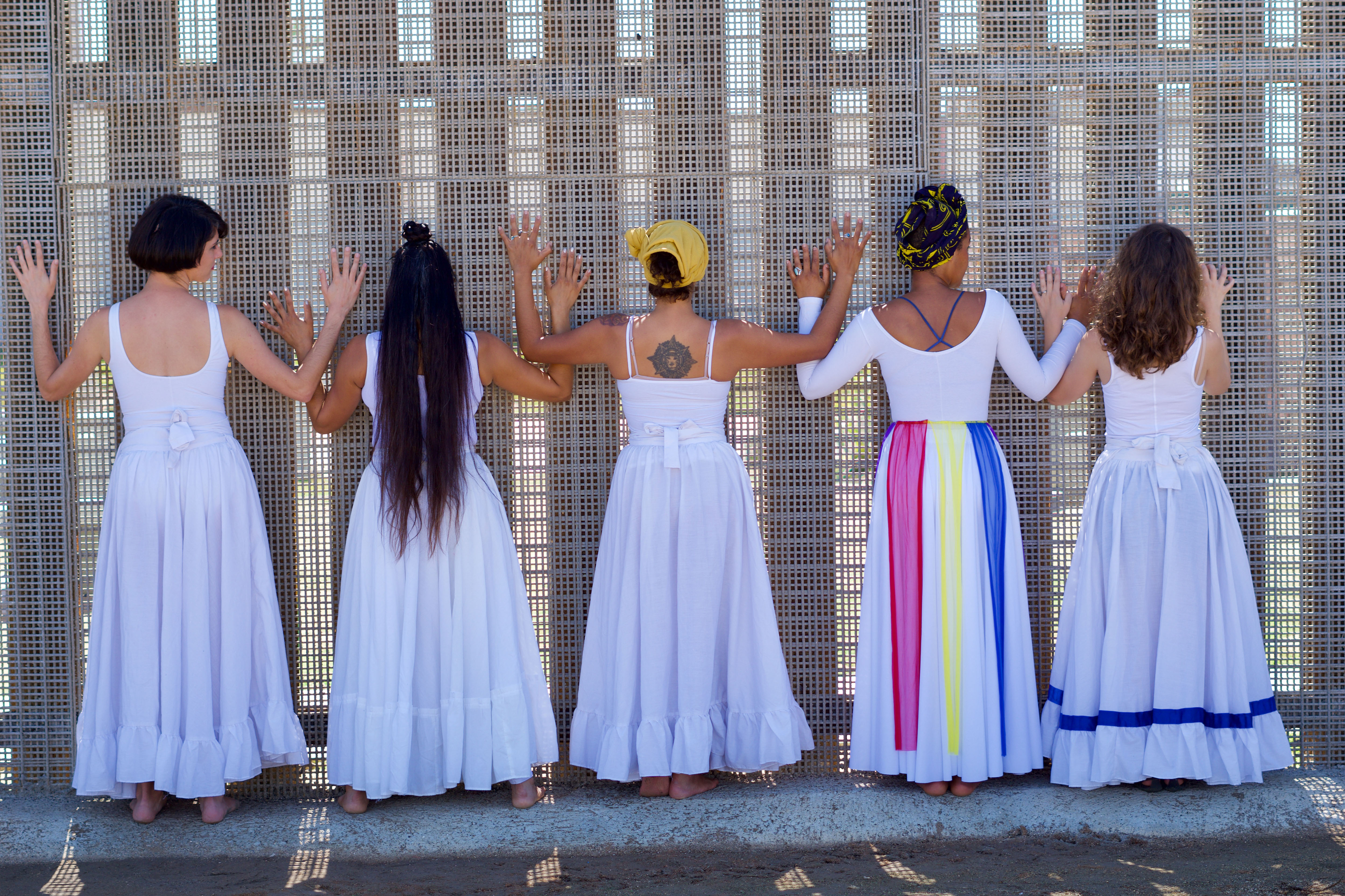 Dancers face a border wall at Friendship Park in San Diego 