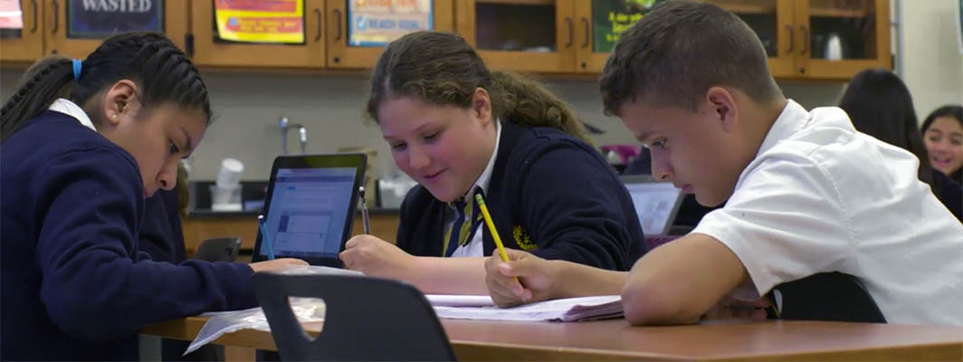 Students at an HP Spotlight School work at their desk