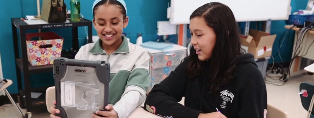 Students in Verizon Innovative Learning School using a tablet