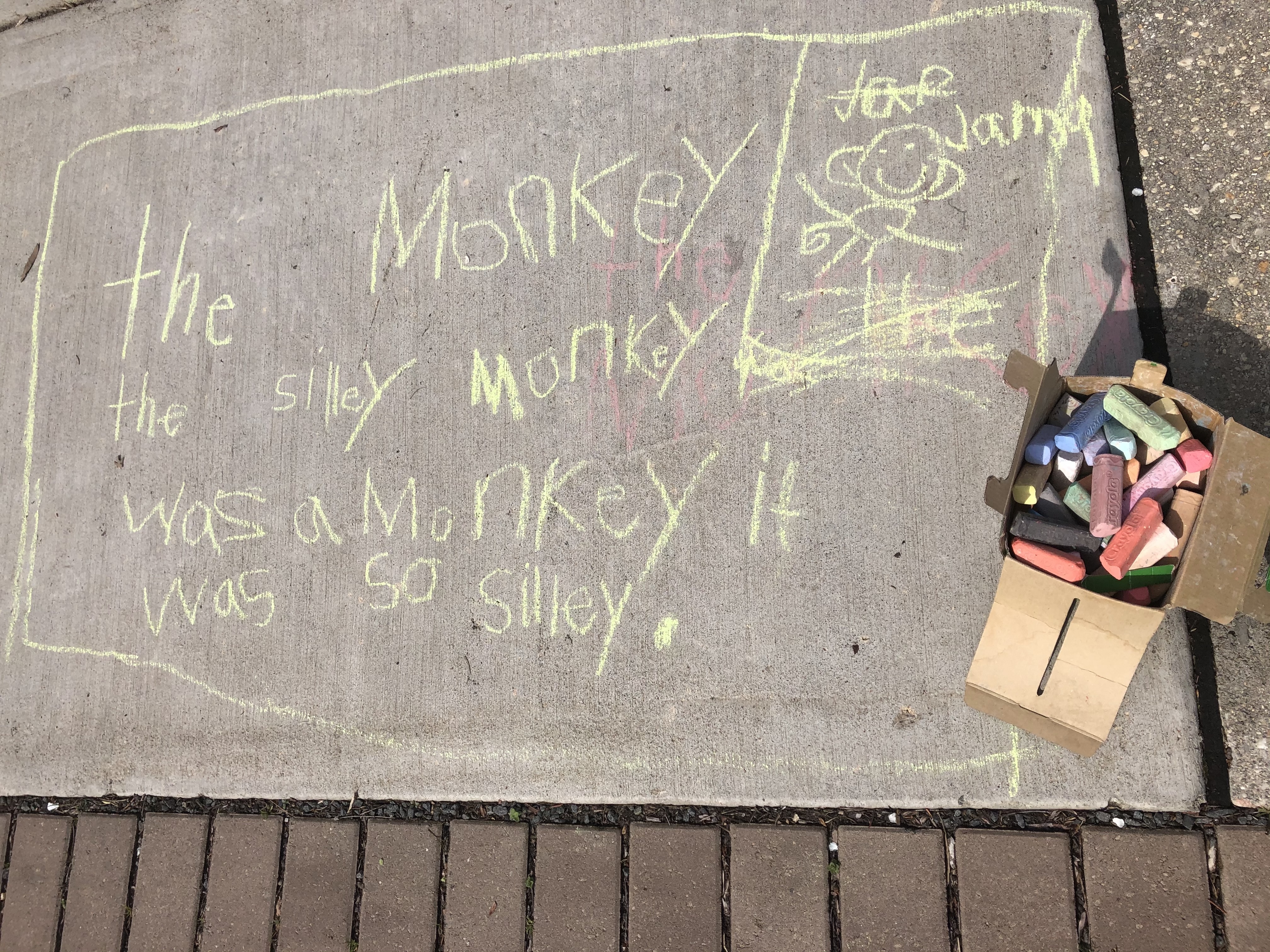 Chalk writing on the sidewalk