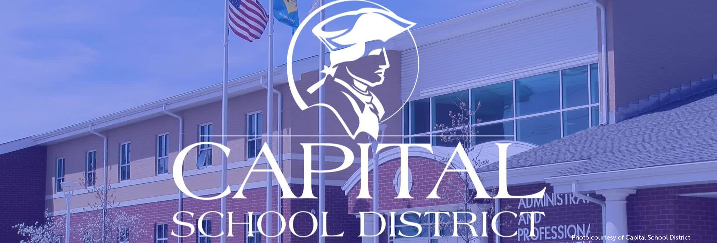 Capital School District logo overlaying image of administrative building