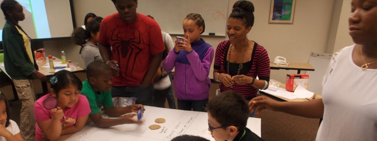 Students and teachers work on a science project