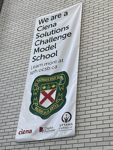 Vertical banner with “We are a Ciena Solutions Challenge Model School” written on it. 
