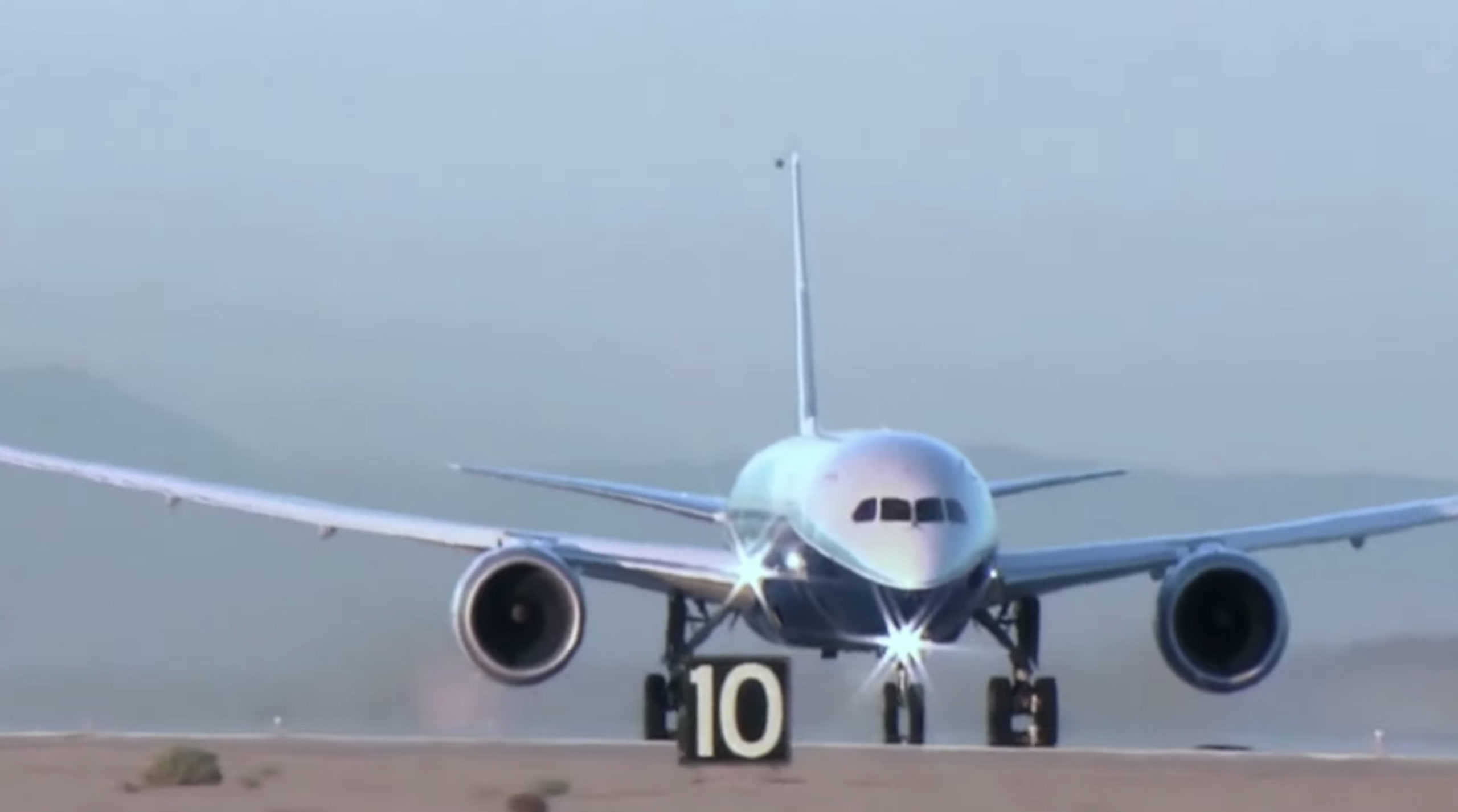 A plane landing on a runway