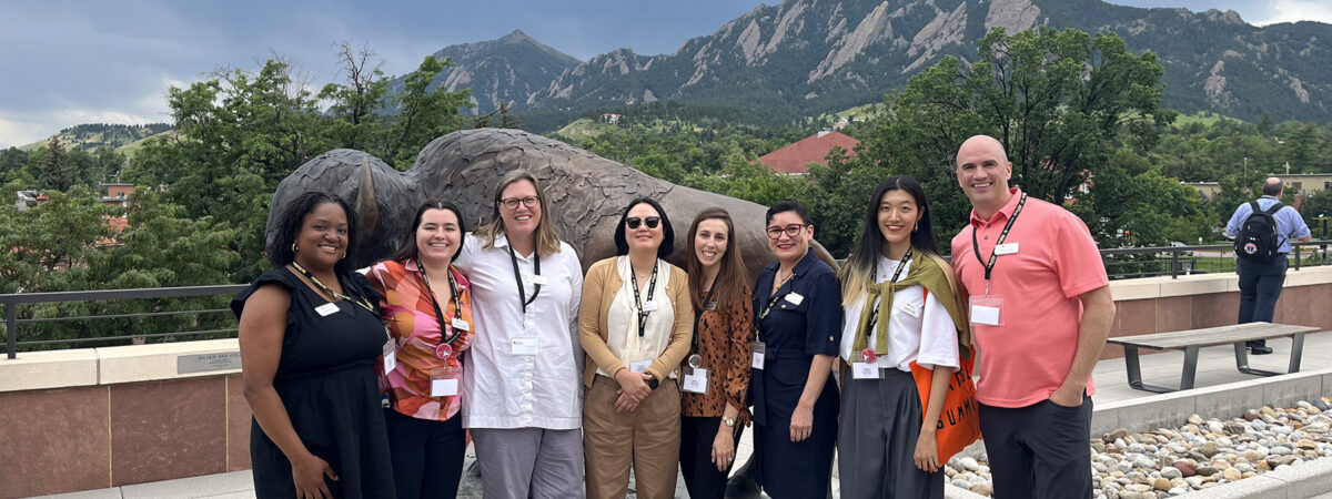 The Micro-credentials team, Nichole Aguirre, Veronique Kulikov, Kristen Franklin, Sangyeon Lee, Marilys Galindo, Rita Fennelly-Atkinson, Keying Chen, and Casey Baxley in attendance at the Badge Summit 2023 in Boulder, Colorado.