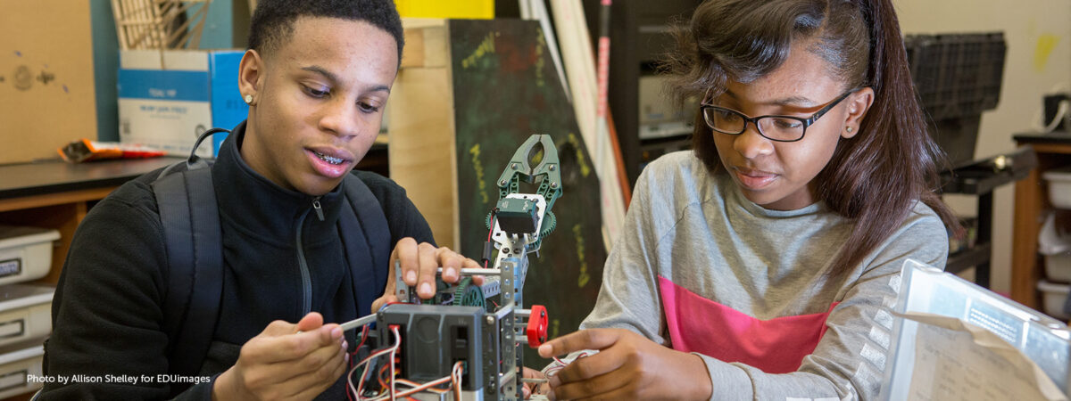 Ninth-grade students assemble a robot in an engineering class at MC2 STEM High School.