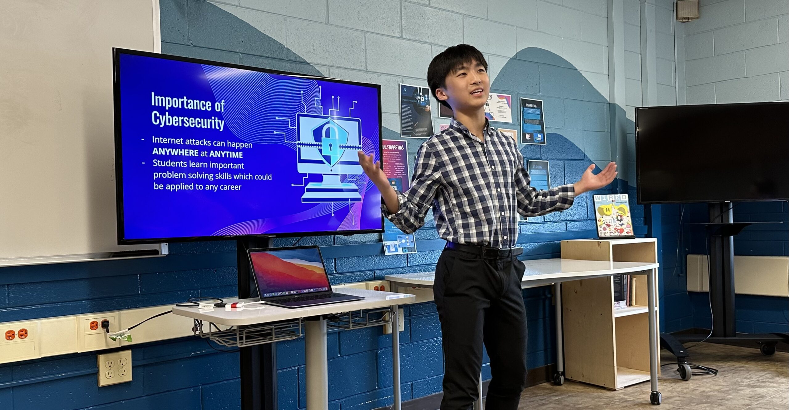 Mineola High School junior Dylan Hsiu gives a presentation on the cybersecurity pathways program at the 2024 League of Innovation Schools Convening.