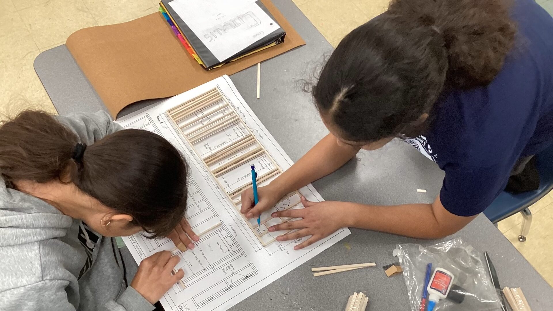 Students work on a prototype for a sustainable classroom.
