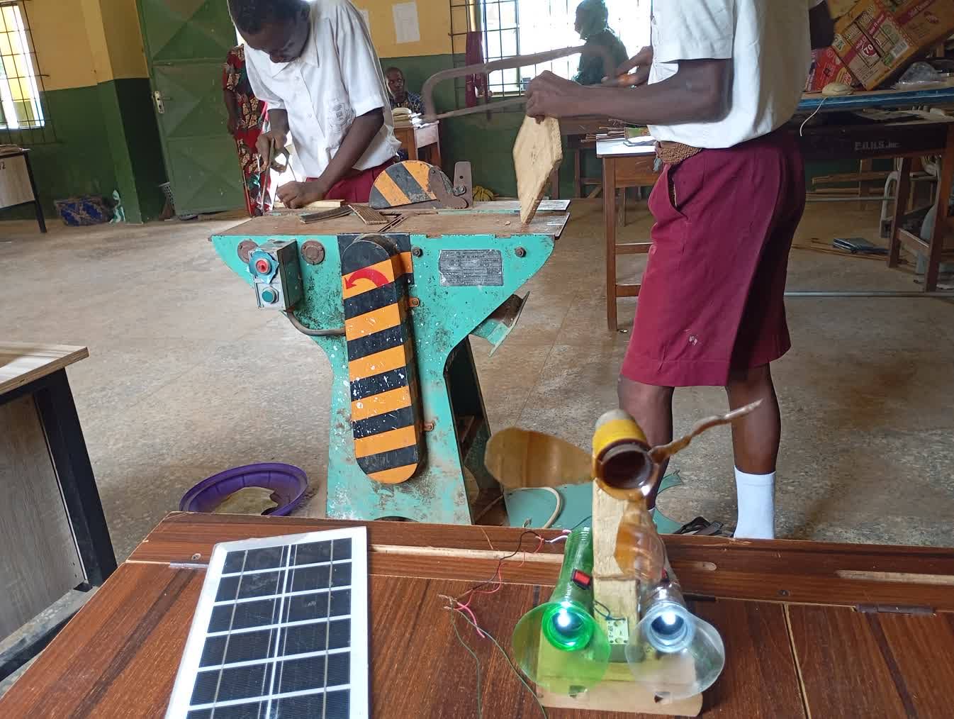 Two students work on a prototype in their classroom