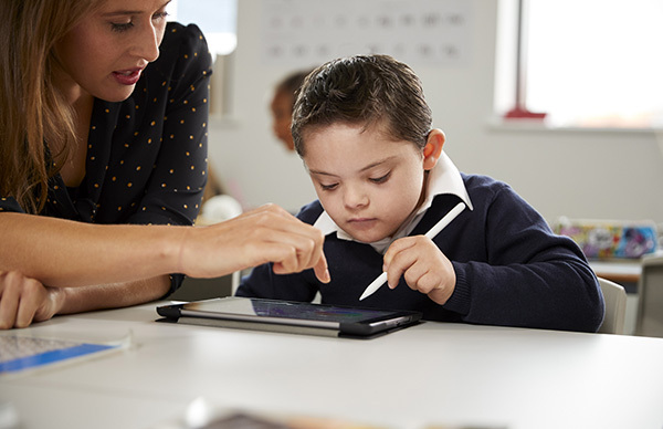 Student and teach exploring a tablet