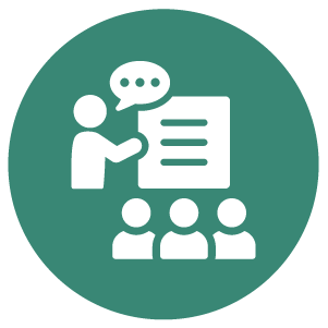 Green circle with a white icon of a teacher pointing at a board and speaking to three figures.