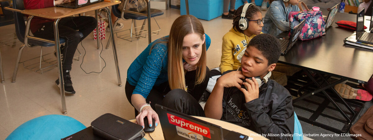 Students at Sutton Middle School compare and contrast songs representing different eras in history during an International Baccalaureate immersion day.