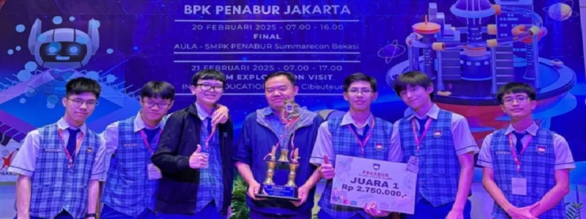A group of pose for a picture on a stage with a trophy