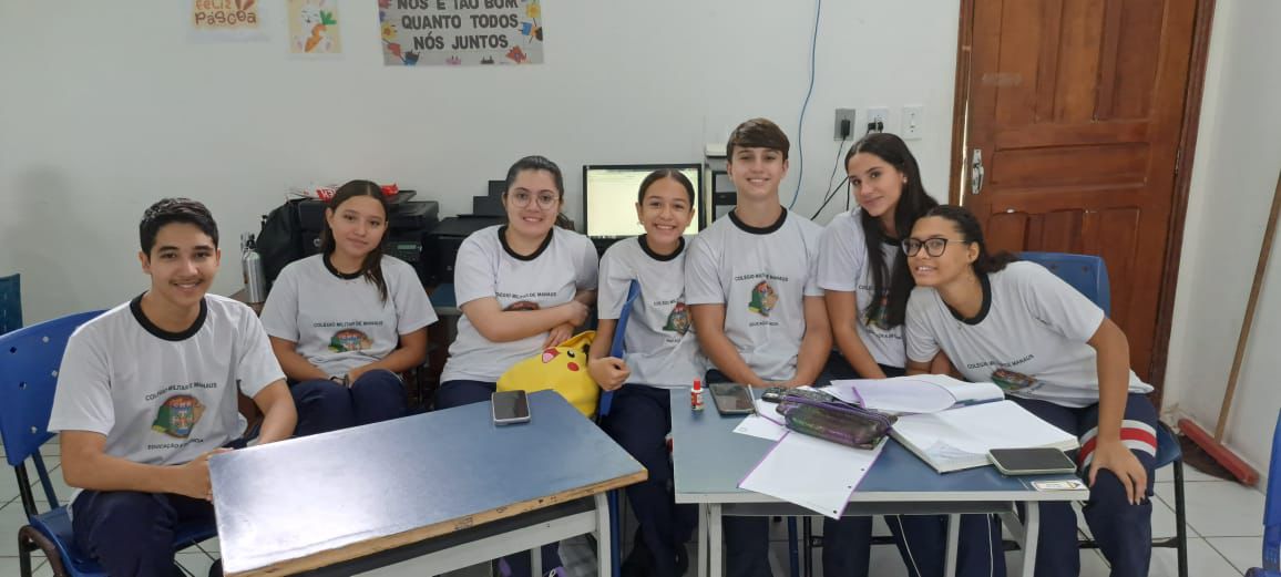 Students pose for a picture in a classroom