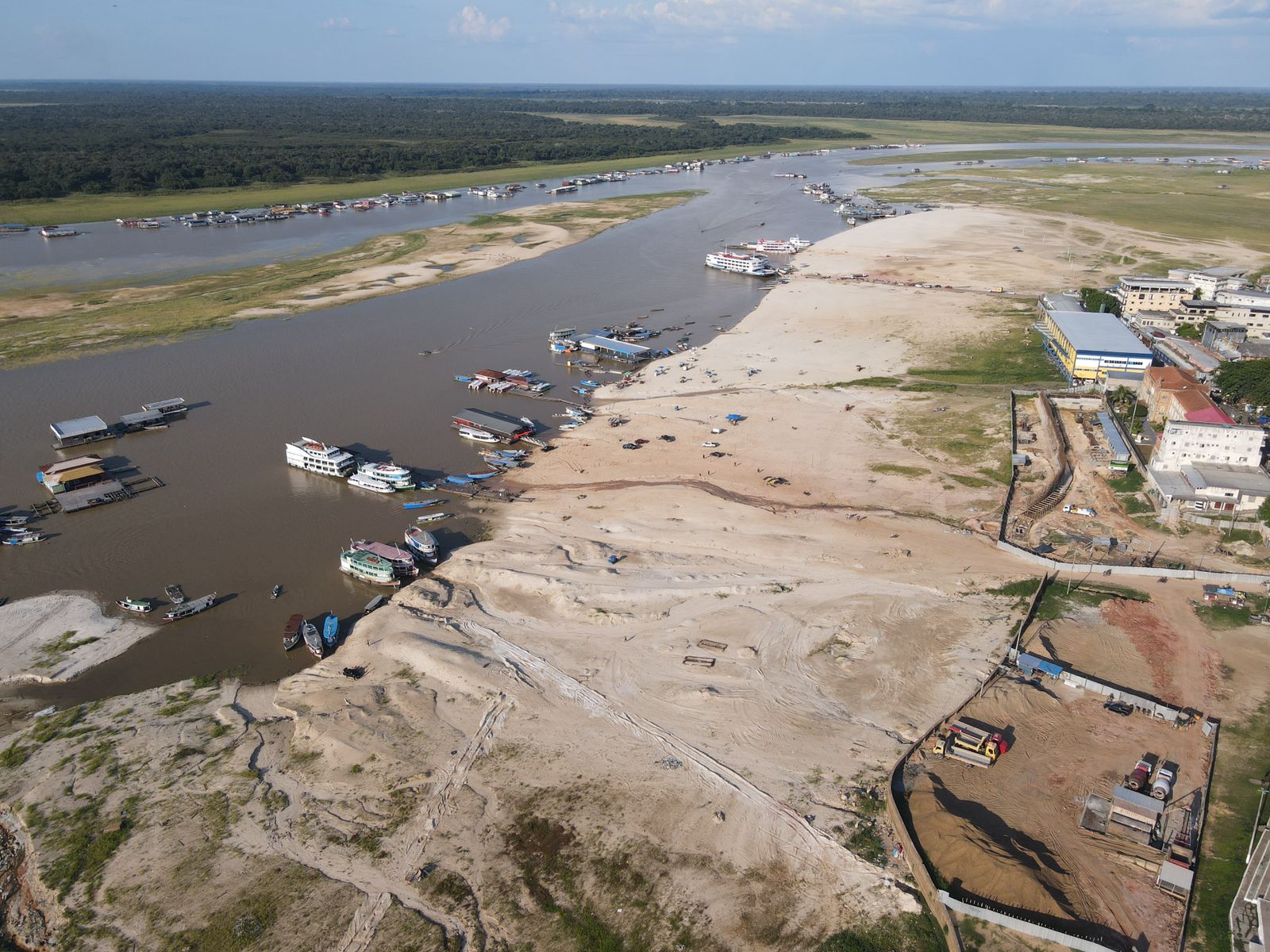 An aerial view of a portion of the Amazon River and a community on the riverbank