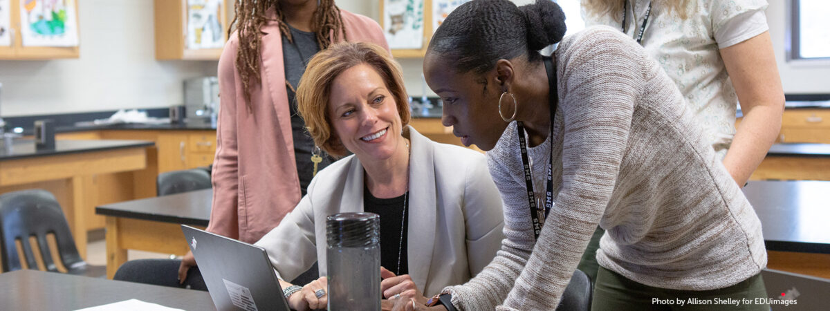 A middle school science team collaborates on their upcoming lessons.