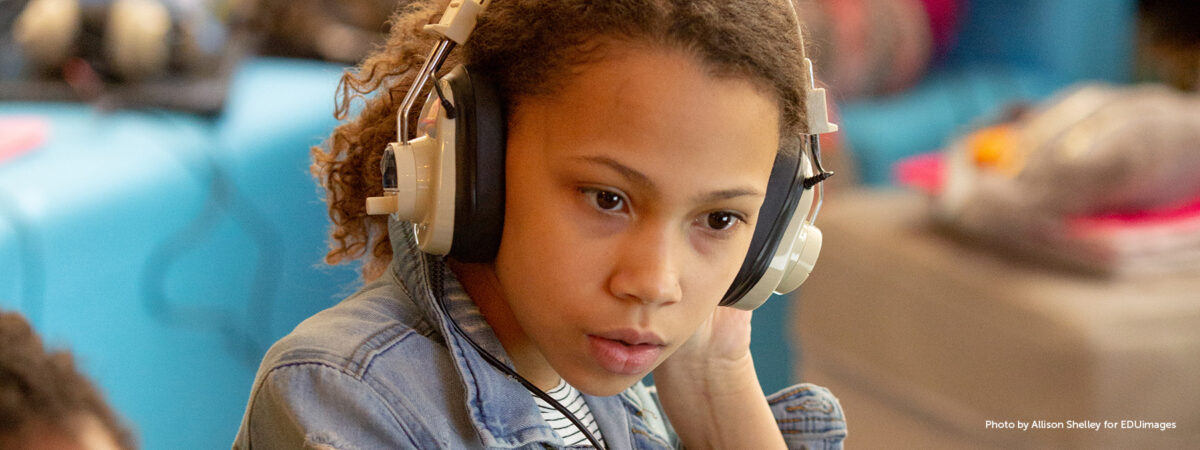 A sixth-grade student listens to music and writes about the feelings the song evokes for her during a lesson in English class.
