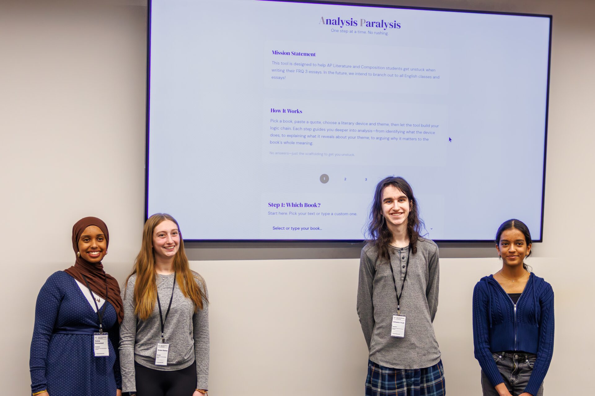 Four students stand in front of a presentation labeled Analysis Paralysis