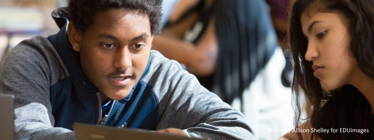 A ninth-grade student explains a new algebraic concept to his classmate.