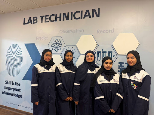 Five students pose for a photo.
